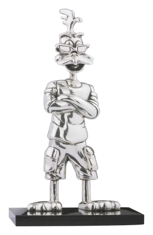 The Lucas candy mascot standing with crossed arms, sculpted in silver on a black base