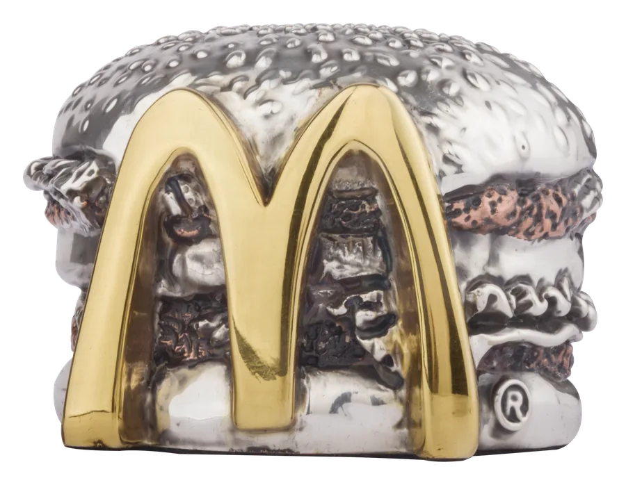 A hamburger sculpted in silver with McDonald’s golden arches in 24-karat gold across the front